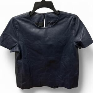 CO size small navy blue leather short sleeve top. Retails for $1295